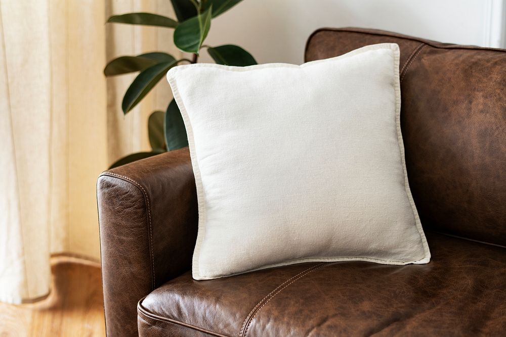 White cushion on a leather couch