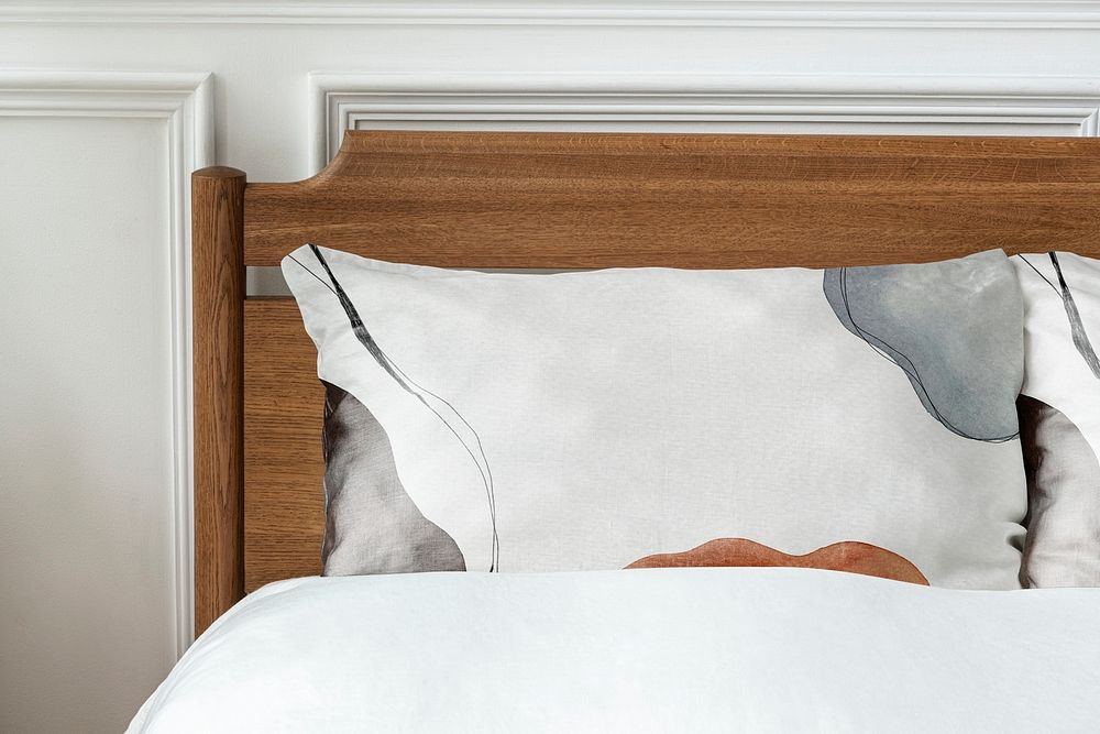 Pillowcase mockup psd in a wooden bed