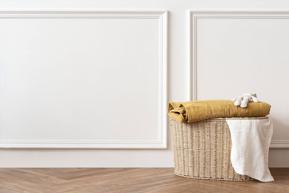 Rattan laundry basket in a white room