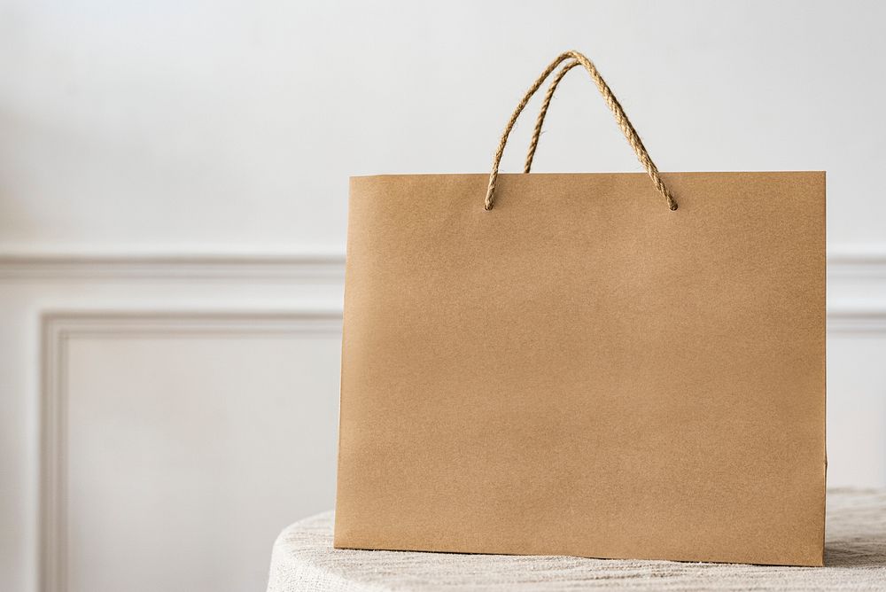 Paper shopping bag in a bright apartment