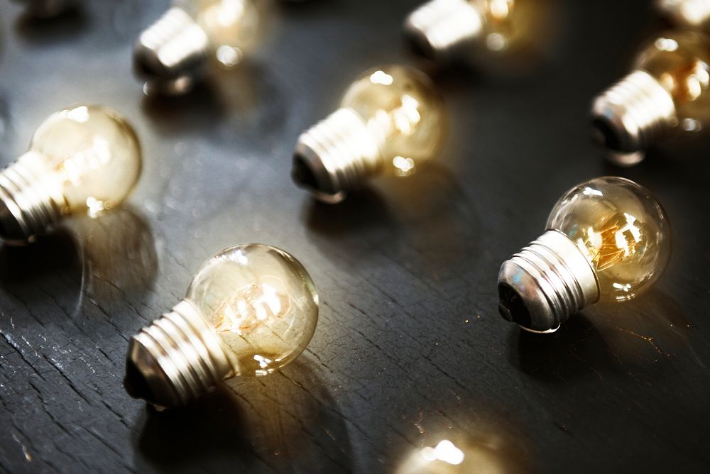 Lightbulbs on black textured table