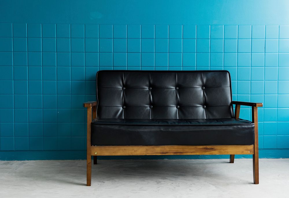 A Black Couch in a Bright Living Room 