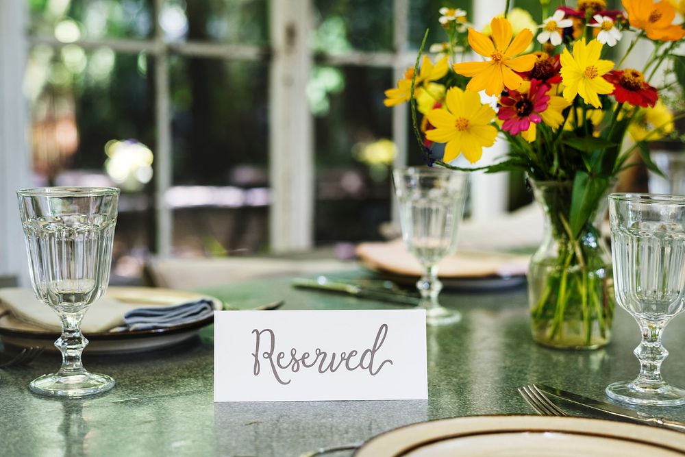 Restaurant table setting service with reserved card