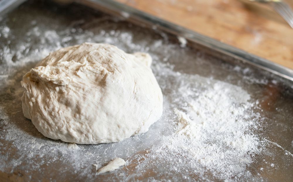 Dough on a tray with flour