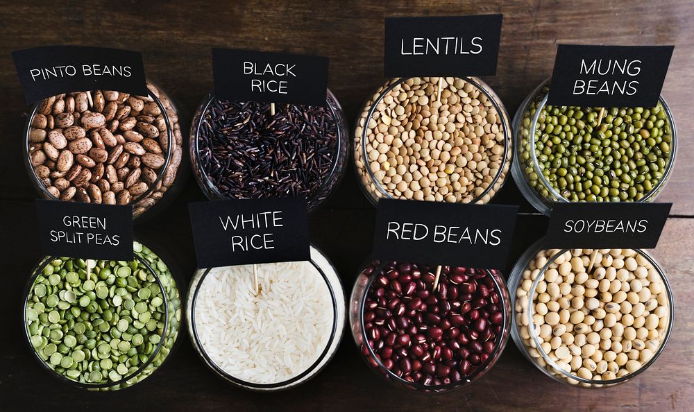 Various types of beans in  glass bowls