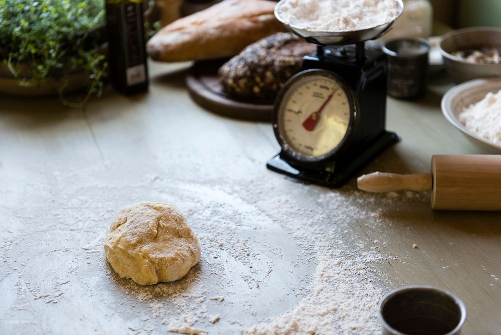 Dough on a table with a weighing scale