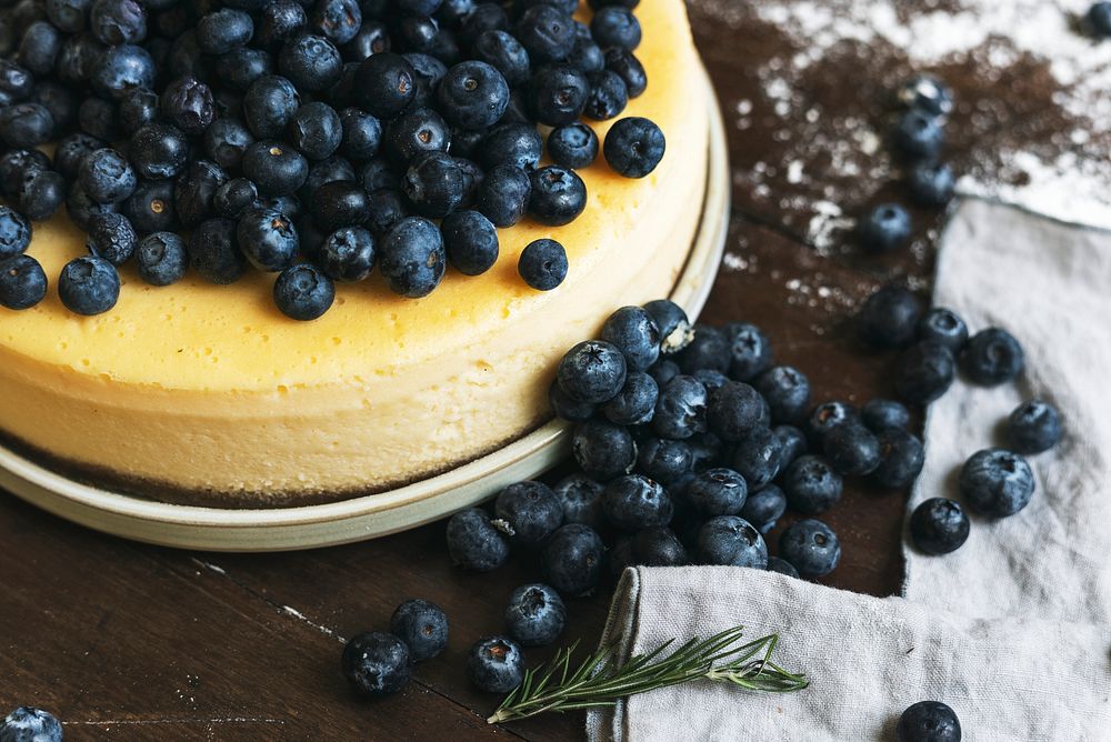 Closeup of a cheesecake decorated with blueberries