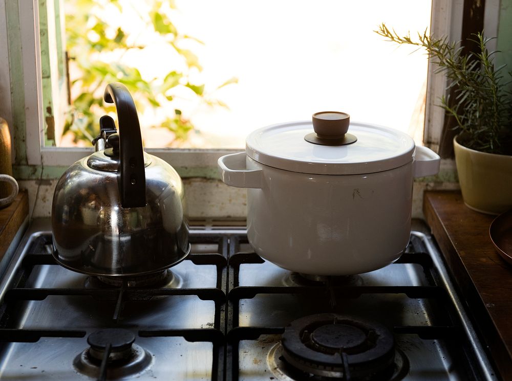 Teapot and a stock pot on a kitchen stove
