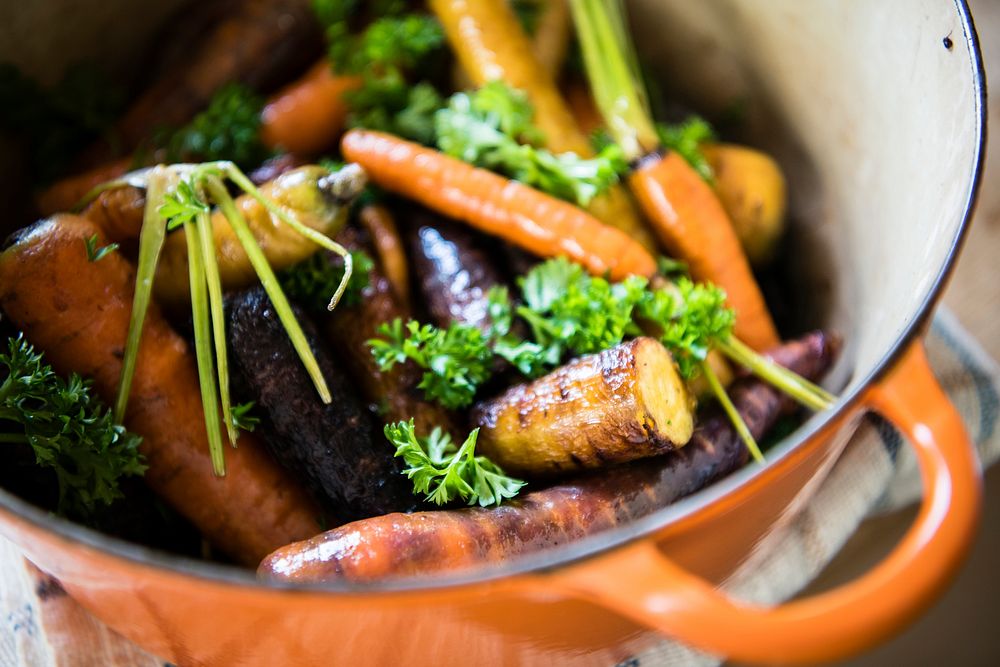 Roasted carrots and parsnips in a pot