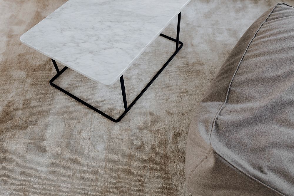 White marble table on a brown carpet