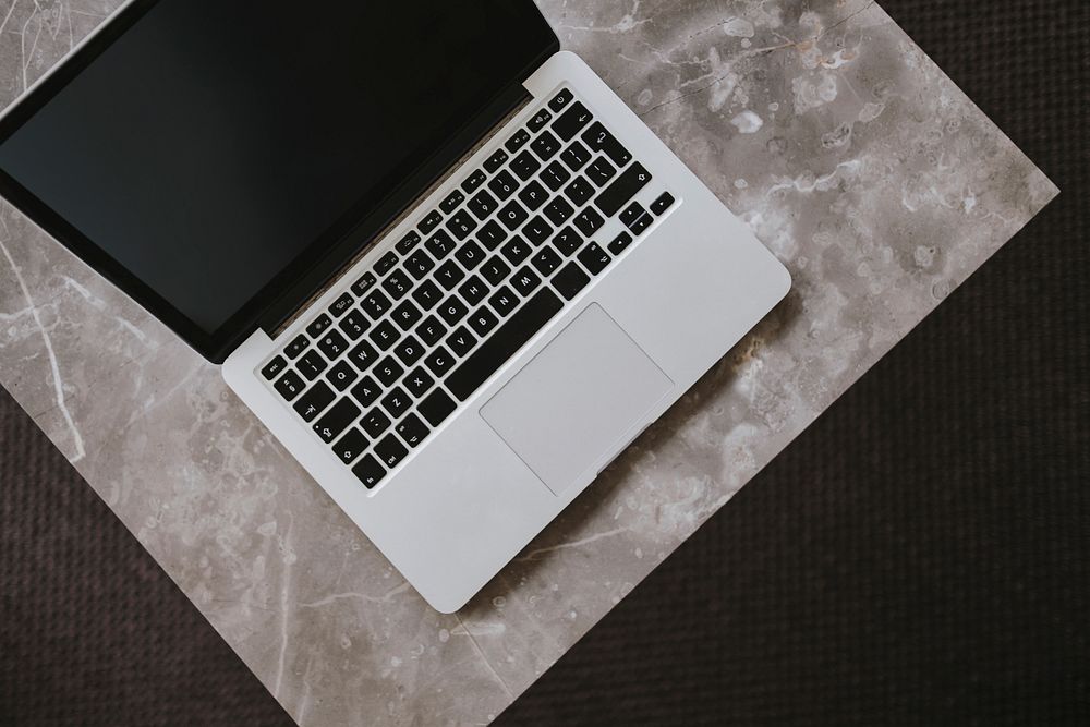 A laptop on a marble table