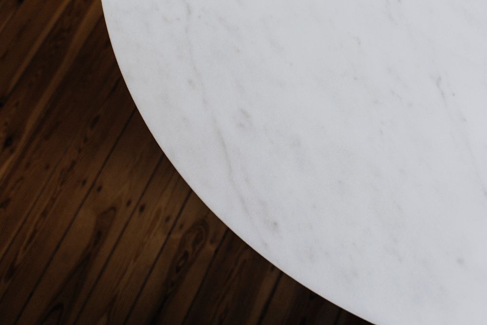 White marble table and a wooden floor
