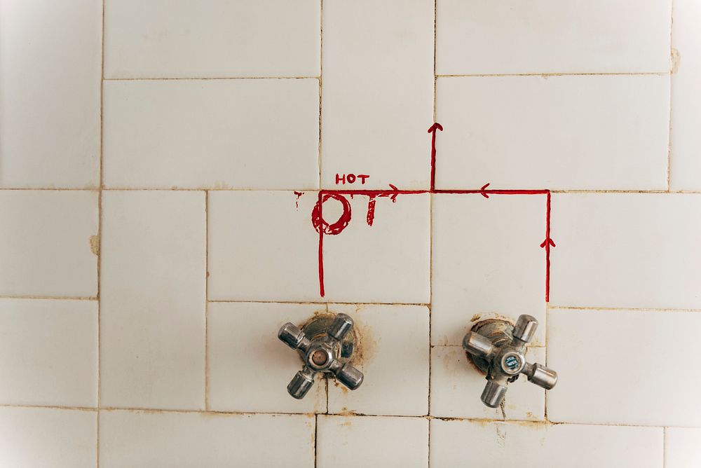 Closeup of a toilet faucet in India