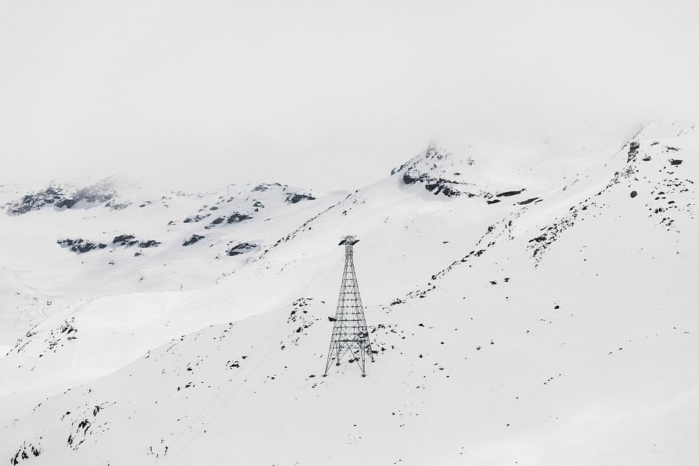 High voltage post on a snowy mountain