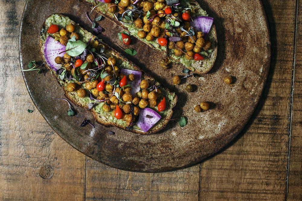 Homemade organic chickpea toast on a wooden plate