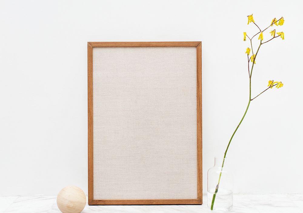 Photo frame by a yellow forsythia