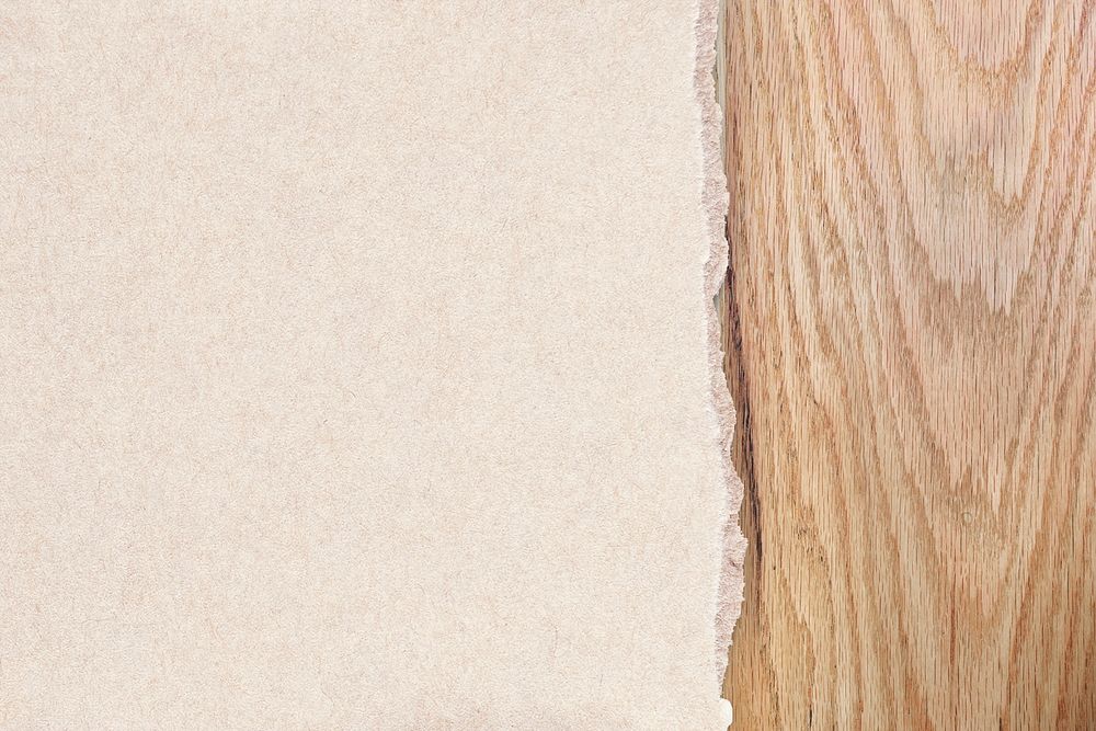 Torn paper mockup with ripped edge on a wooden texture