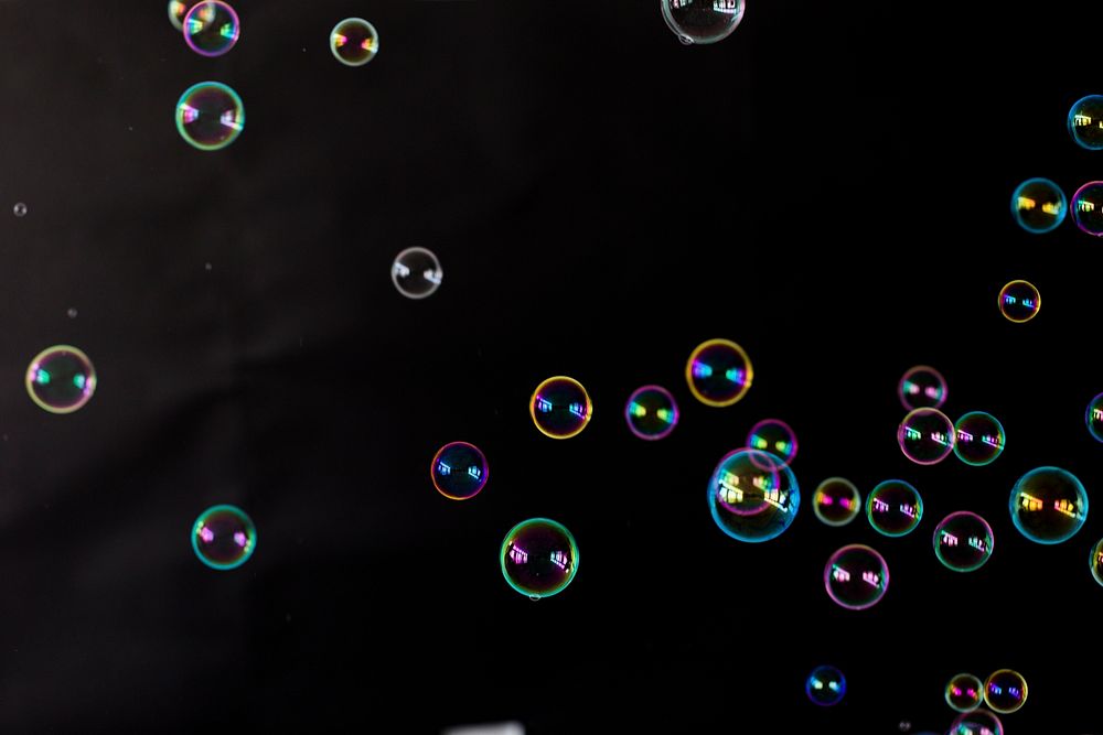 A bunch of bubbles on a black background