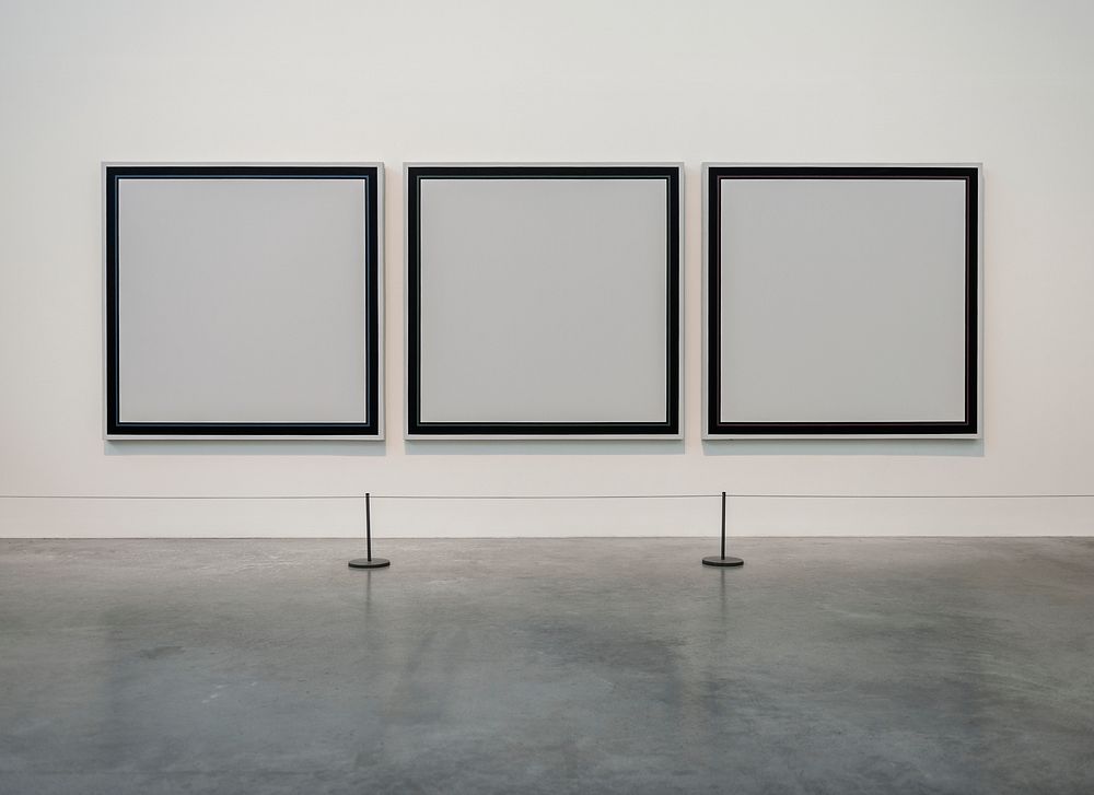 Three empty painting frames in an exhibition