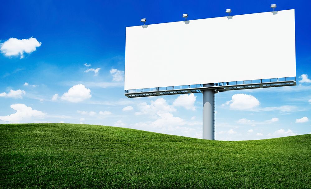 Large white blank billboard on a hill