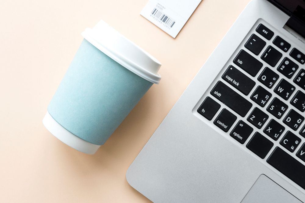 Coffee cup and laptop mockup