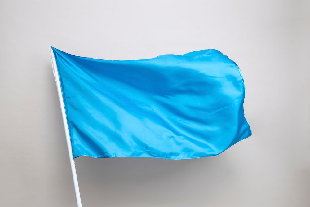 Waving blue flag on a gray background