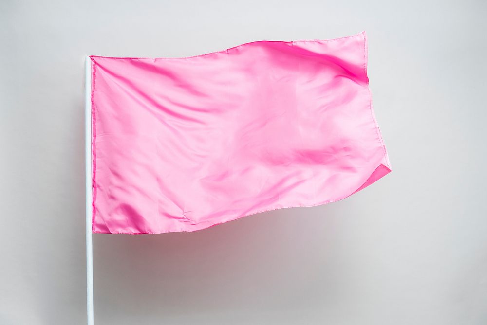 Waving pink flag on a gray background