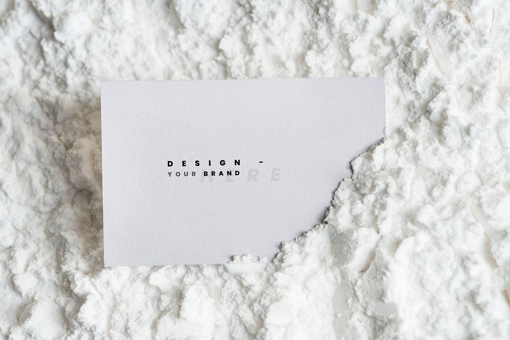 Blank business card mockup on white powder
