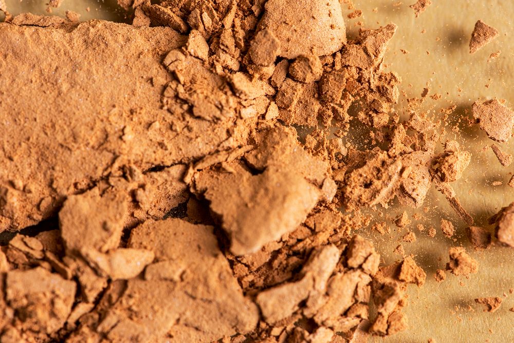 Broken bronzer makeup powder background 