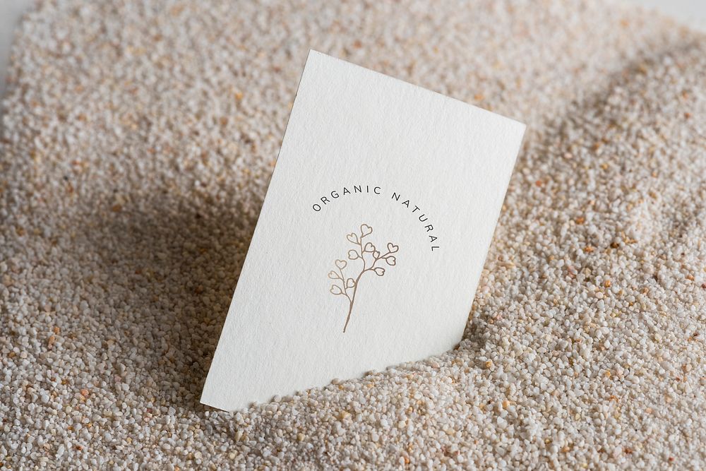 Blank business card mockup on the sand