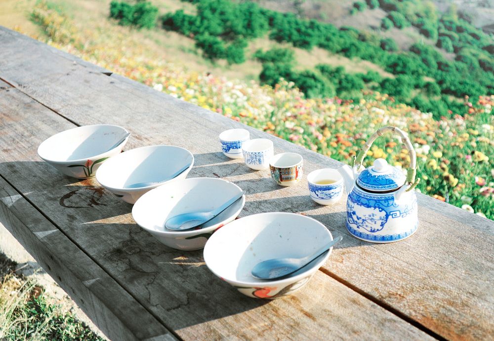 Tea and soup bowls on an outdoor table