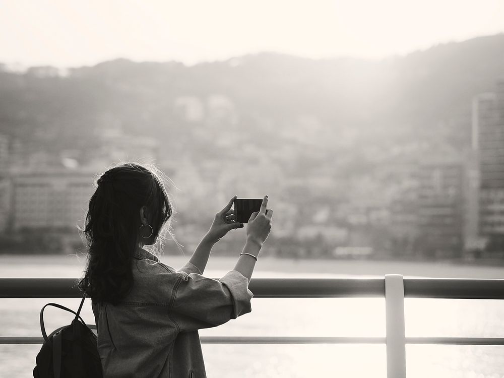 Woman taking scenic photo