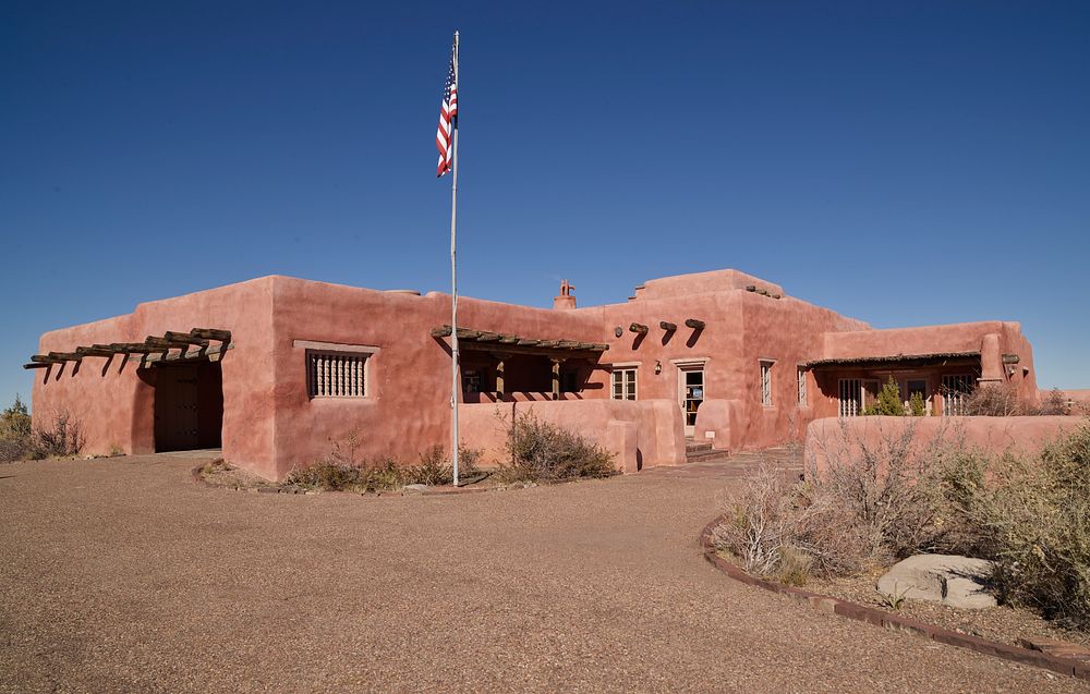 The Painted Desert Inn, originally built of petrified wood and other native stone and modified to this adobe configuration…
