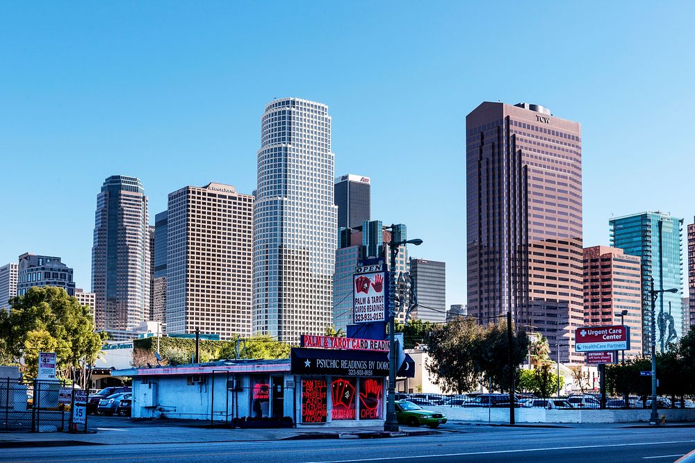 Skyline of Central Los Angeles, California, showing the contrast between old (including a tattoo parlor, foreground, and…