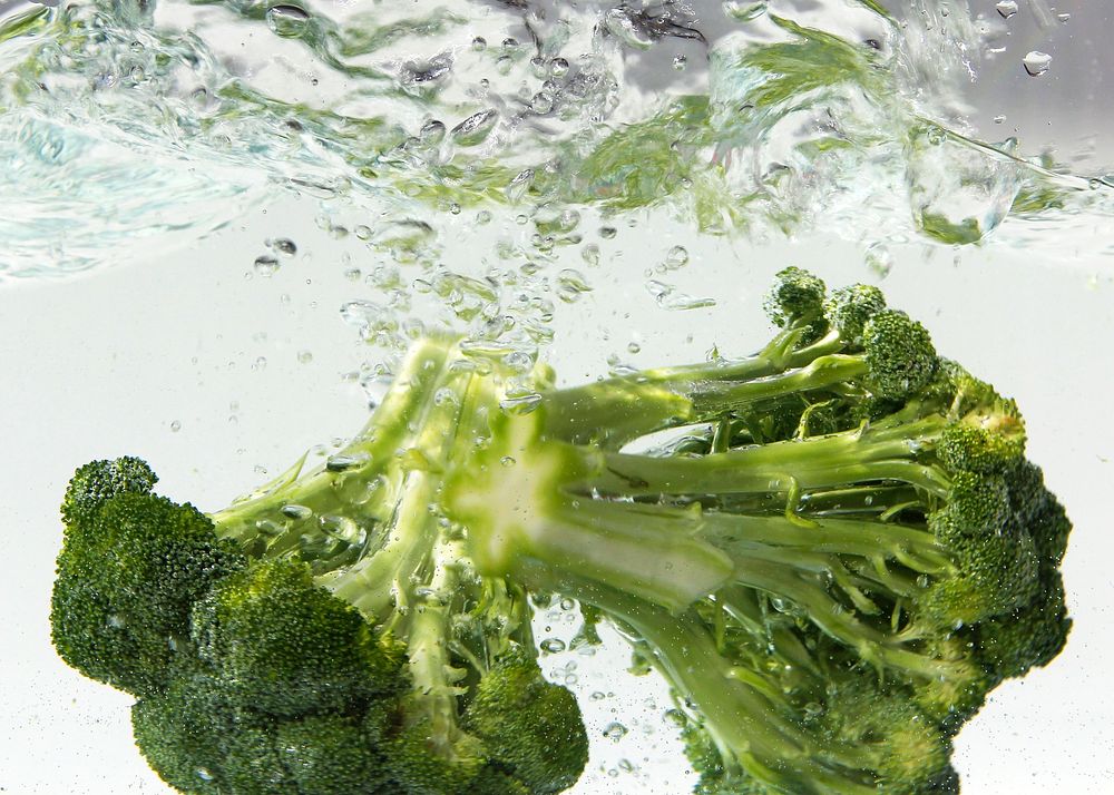 Green broccoli undergoing a thorough cleansing. Original image sourced from US Government department: Public Health Image…