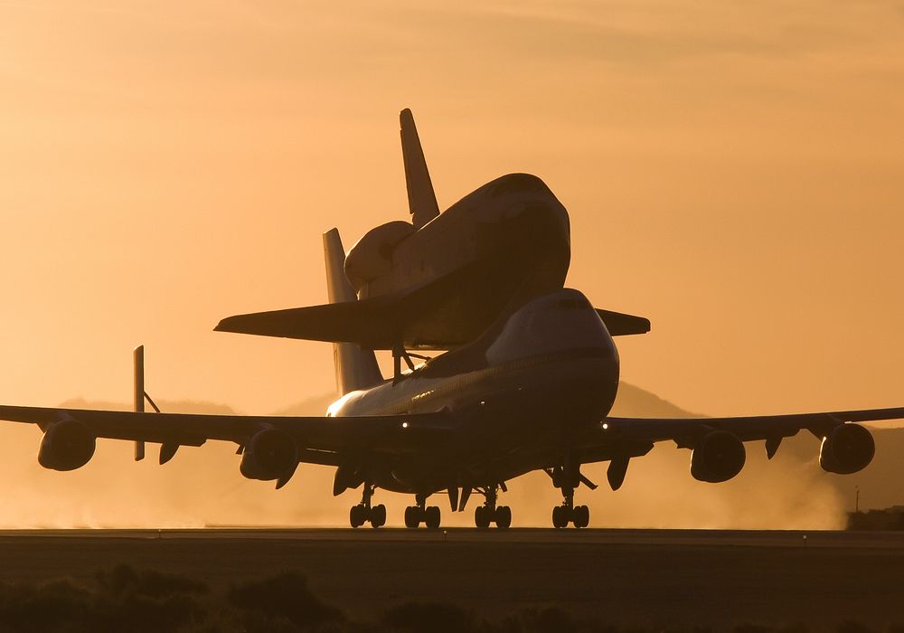 NASA's modified Boeing 747 Shuttle Carrier Aircraft with the Space Shuttle Atlantis on top lifts off from Edwards Air Force…