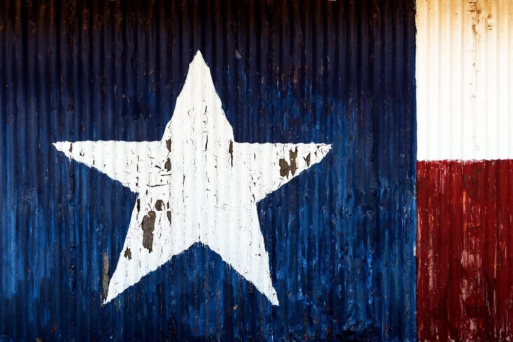Metal side of a barn, decorated with a painting of the Flag of Texas, near Fort Davis in Jeff Davis County, Texas. Original…