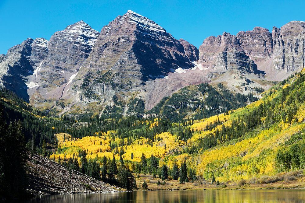 The Maroon Bells, just outside Aspen in Colorado's Rocky Mountains USA - Fall aspens in San Juan County, Colorado USA -…