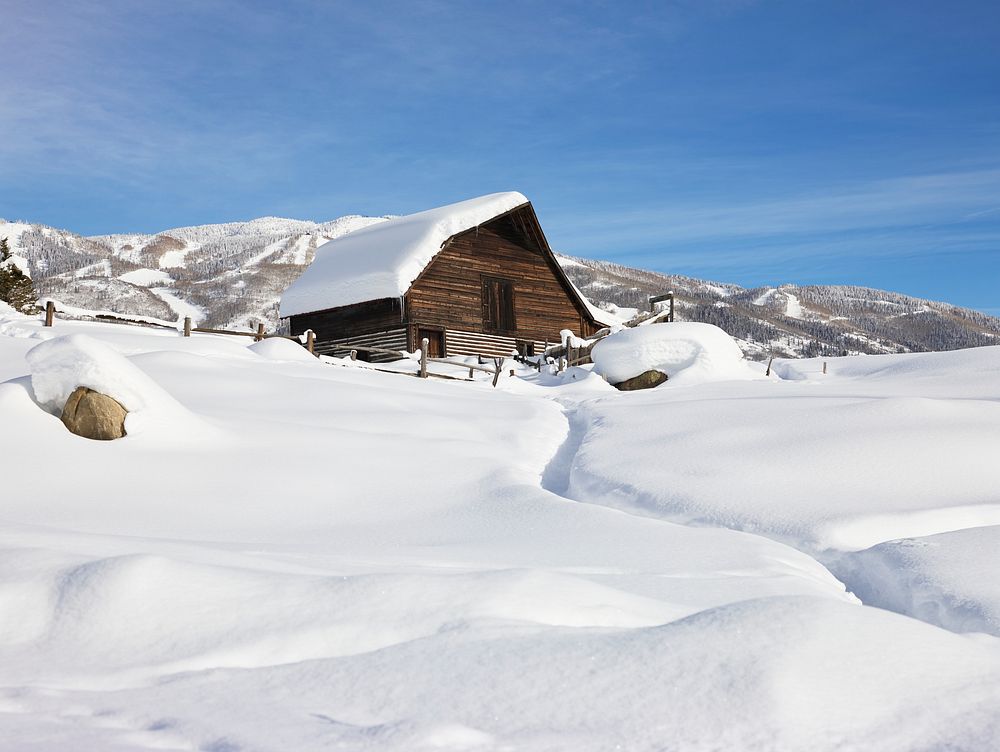 Heavy snow surrounds and lies a top a cabin in Steamboat Springs, Colorado. Original image from Carol M. Highsmith&rsquo;s…