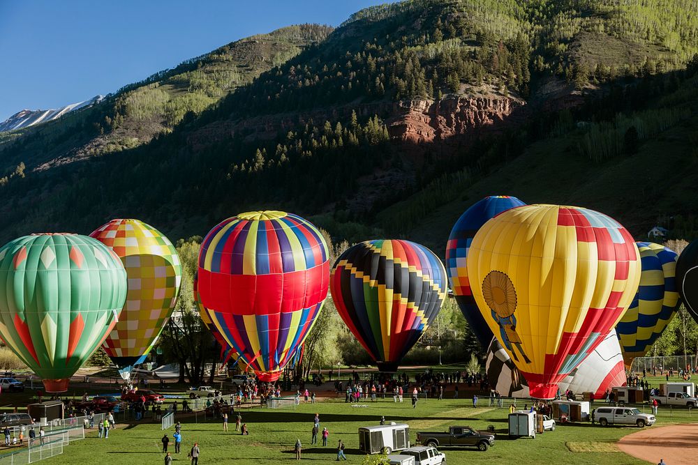 Colorful and cleverly designed hot-air balloons at the annual Telluride Balloon Festival. Original image from Carol M.…