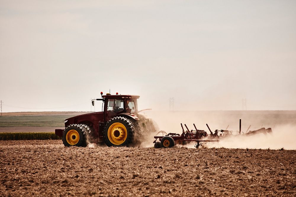 A farmer kicks up dust as he readies the ground for planting near Bristol in Prowers County, Colorado. Original image from…