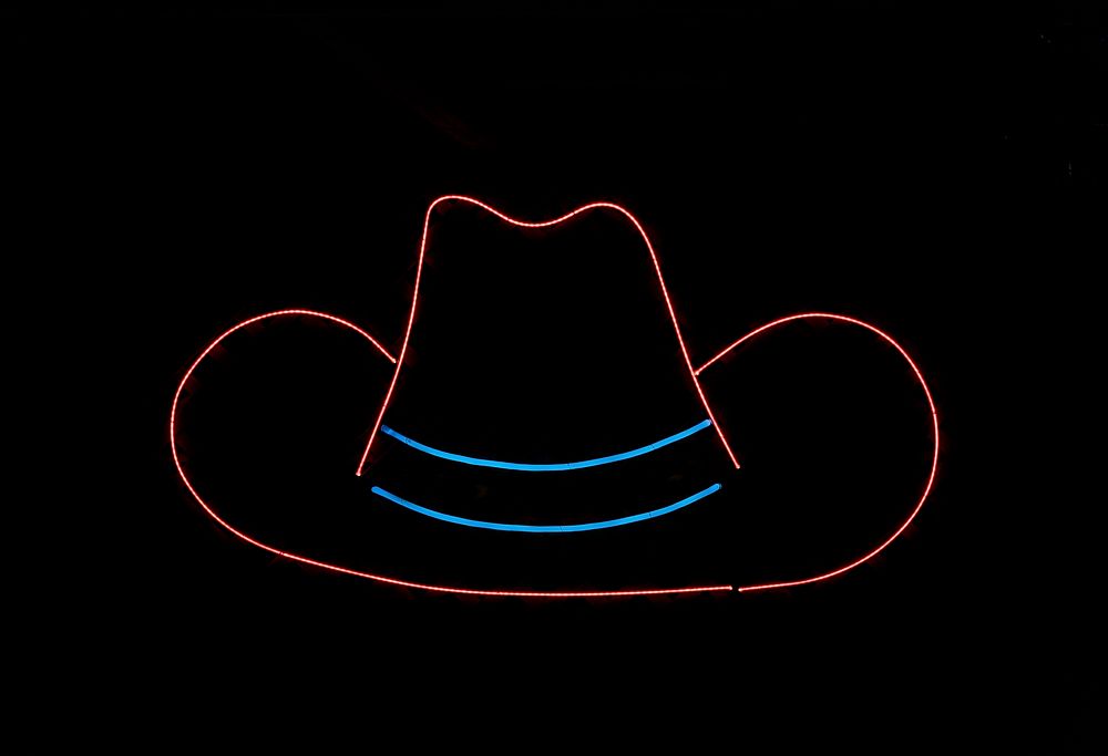 Cowboy-hat neon in a food tent at the Iowa State Fair in the capital city of Des Moines. Original image from Carol M.…