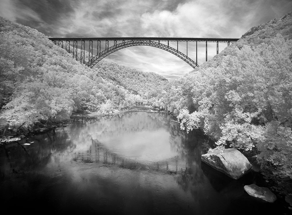 Infrared-camera view of the New River Gorge Bridge in Fayette County, West Virginia. Original image from Carol M.…