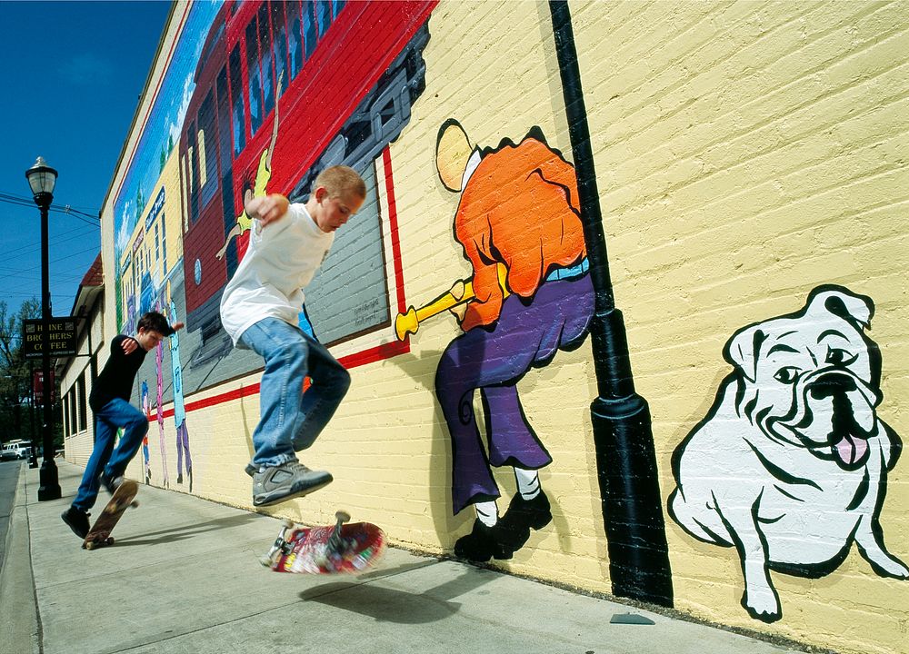 Actual skateboarders mimic those on a street mural, Louisville, Kentucky (1980-2006) by Carol M. Highsmith. Original image…