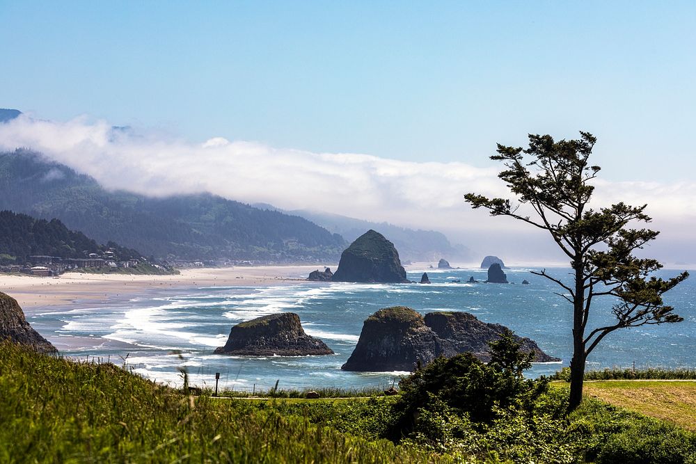 A small fogbank hovers over the rocky northern Oregon coast, near Ecola State Park, north of the town of Cannon Beach.…