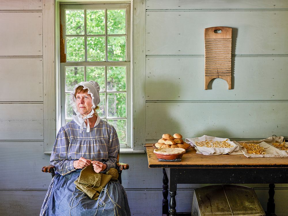 Costumed interpreter Diane Engle knitting at Old Sturbridge Village in Sturbridge, Massachusetts. Original image from Carol…