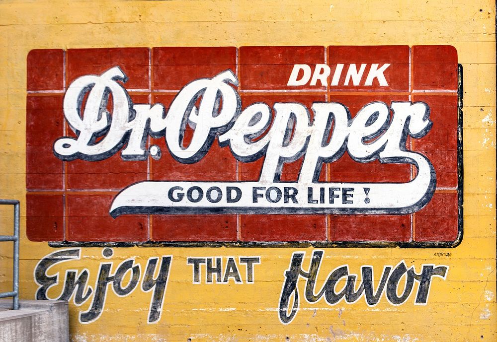 Vintage Dr Pepper advertisement on an exterior wall of the Dr Pepper Museum in Waco, Texas. Original image from Carol M.…