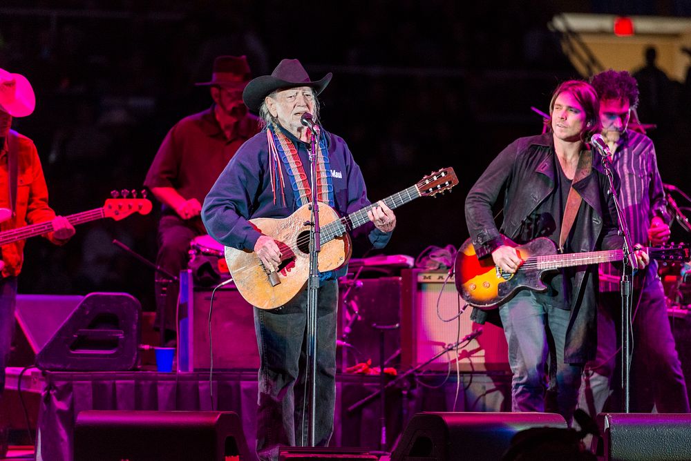 Country singer-songwriting legend Willie Nelson performs with his band at Rodeo Austin, Texas. Original image from Carol M.…