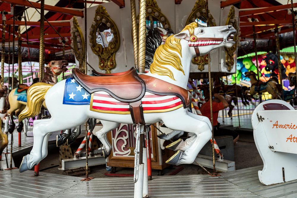 A carousel ride at the annual Iowa State Fair in the capital city of Des Moines. Original image from Carol M.…