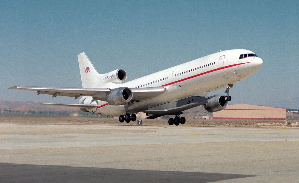 X-34 mated to modified L-1011 during takeoff on first captive carry flight. Original from NASA. Digitally enhanced by…